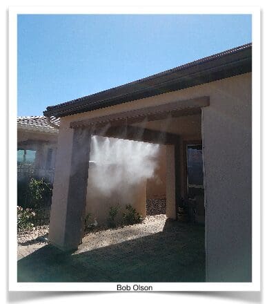 A house with a fire hydrant spraying out of it.