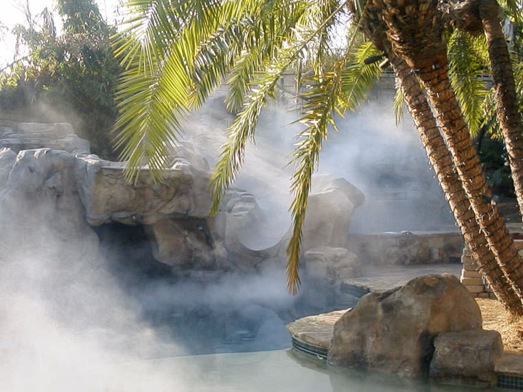 A hot spring with steam coming out of it.