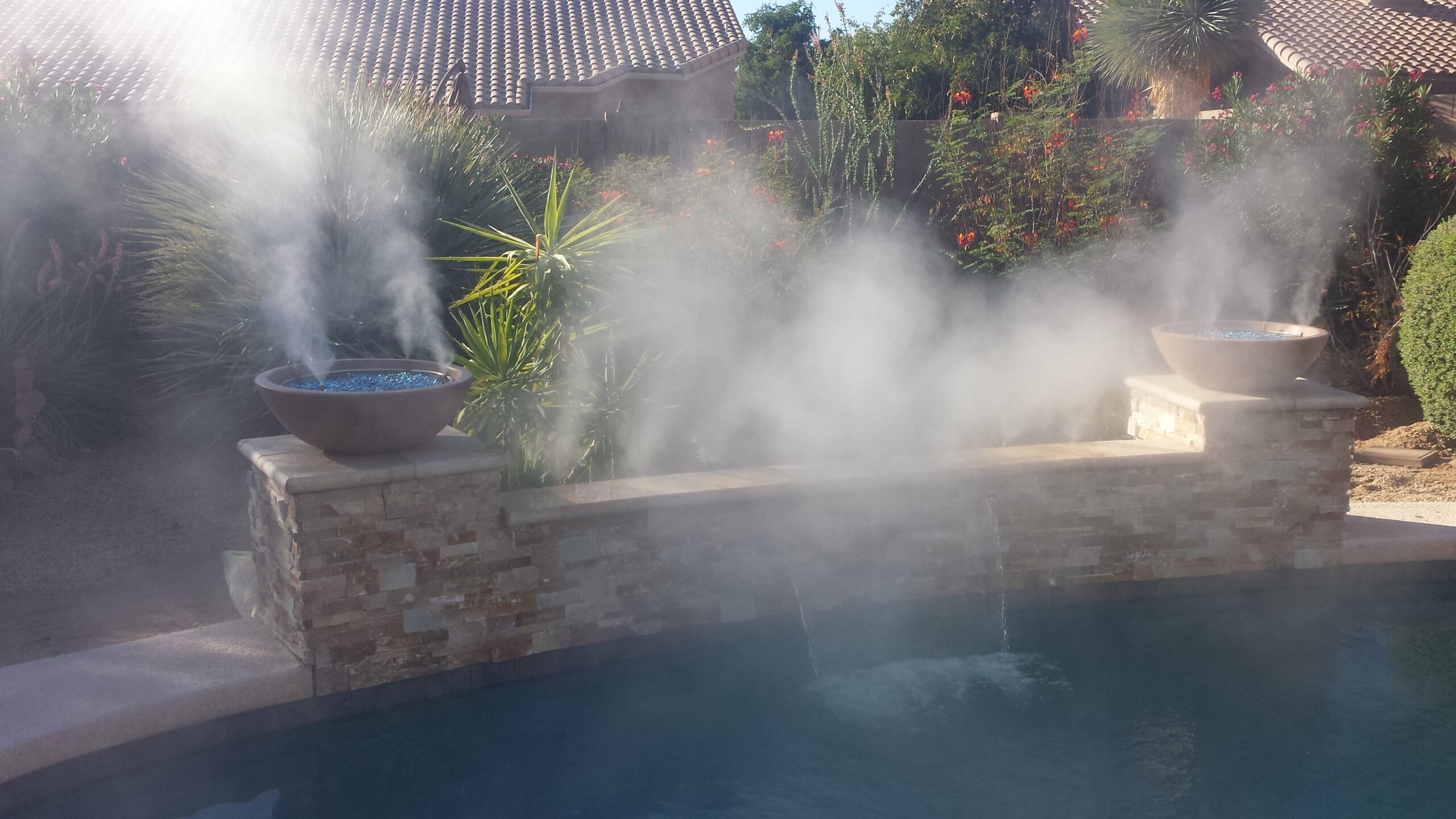 A pool with steam coming out of it.